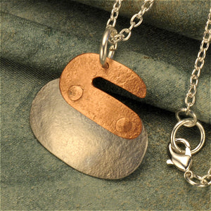 Curling rock two-tone necklace