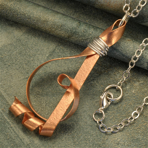 Treble clef necklace